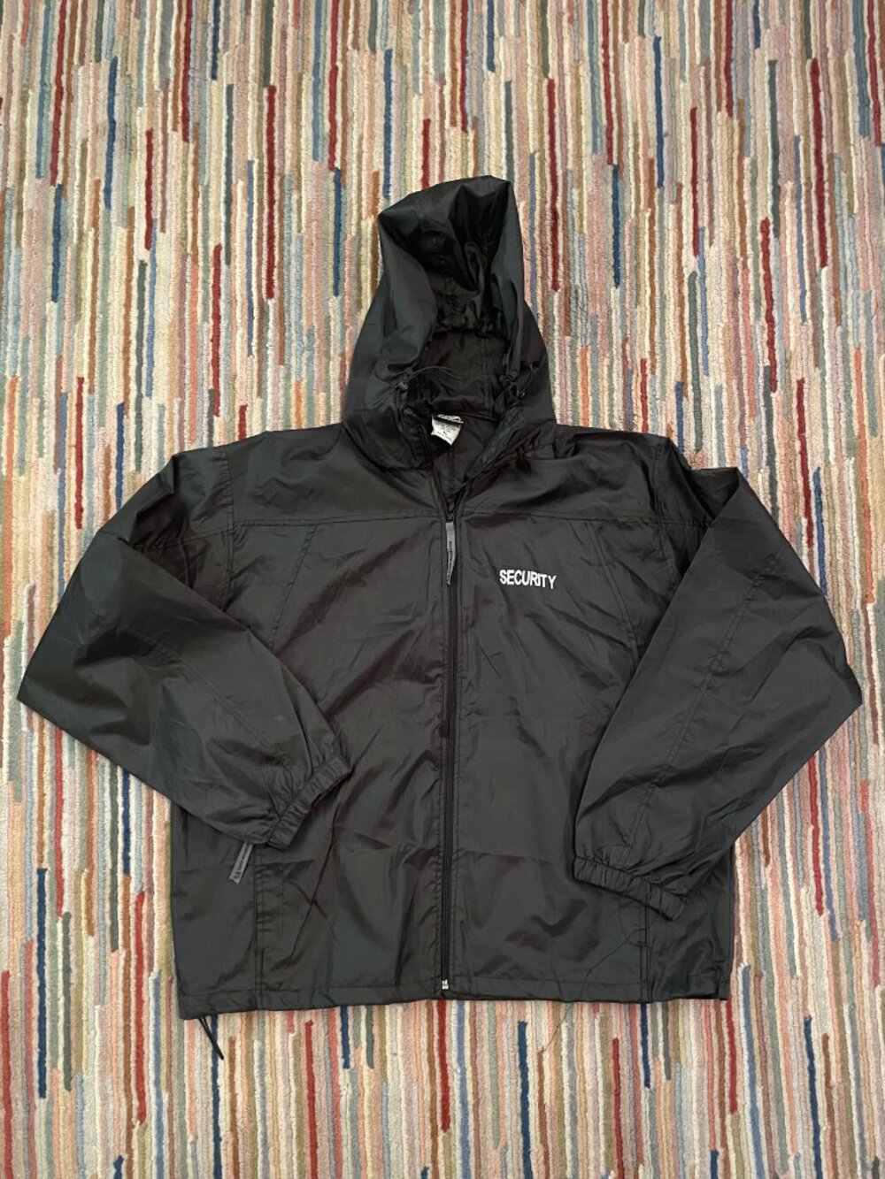 SECURITY Black Windbreaker. Words on front left and back, XL.